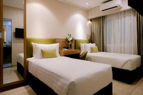 Goldberry Suites and Hotel Cebu客房内的一张或多张床位