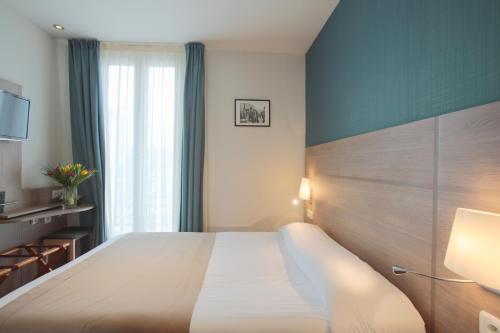 杜卢瓦雷大酒店客房内的一张或多张床位
