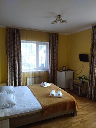 Tulsky Lago-Naki Guest House客房内的一张或多张床位