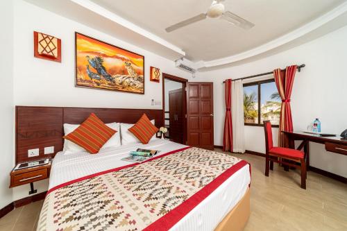 PrideInn Hotel Nyali客房内的一张或多张床位