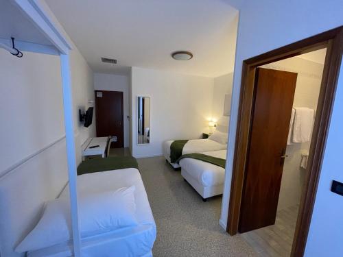 Casa Valcellina Hotel Ristorante客房内的一张或多张床位