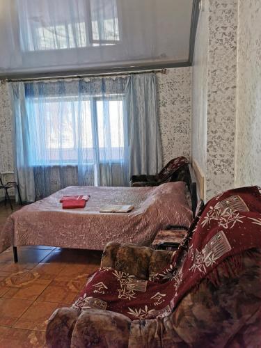 科穆尼斯蒂奇斯基之家公寓客房内的一张或多张床位