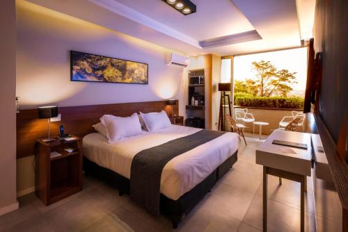 Pinares del Cerro Resort & Suites客房内的一张或多张床位