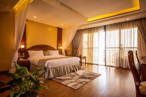 Kalanoga Resort客房内的一张或多张床位