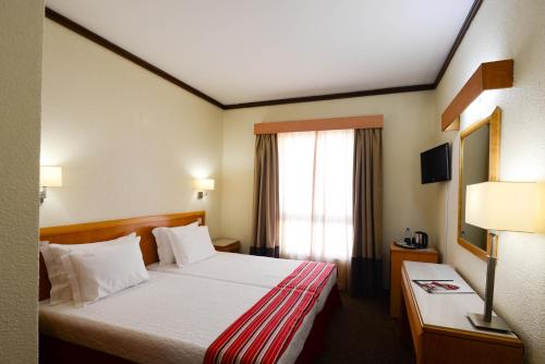 多姆努诺酒店客房内的一张或多张床位