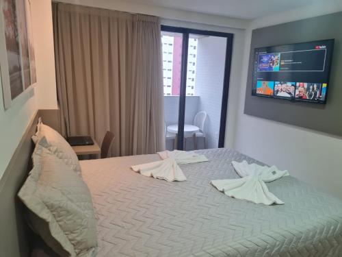 Flat no Guest Manaíra Apart Hotel客房内的一张或多张床位