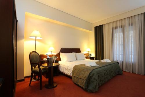 Hotel Apollonia客房内的一张或多张床位