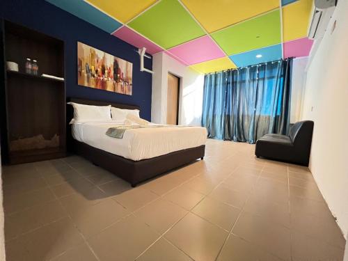 Cassia Inn Kuching客房内的一张或多张床位
