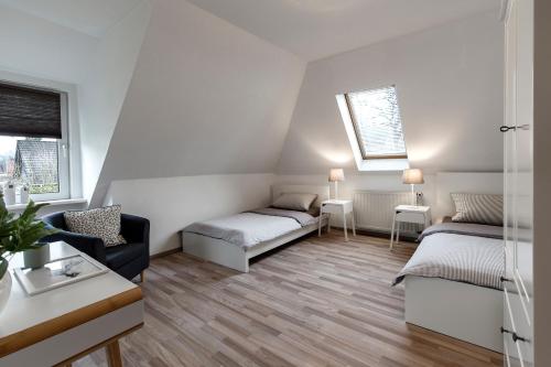 阿卡迪亚之家汉堡机场公寓客房内的一张或多张床位