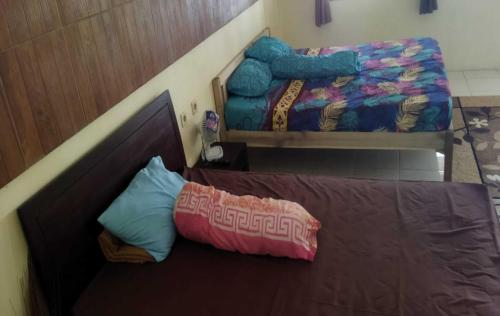 Borobudur Kampung Homestay - MARKONI客房内的一张或多张床位