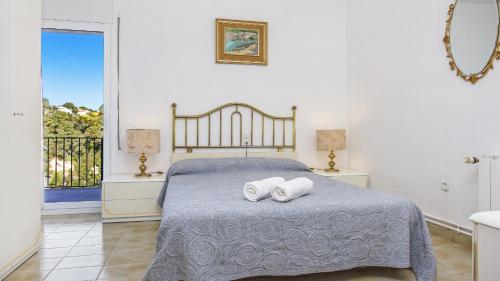 2Tere - Lloret de Mar客房内的一张或多张床位