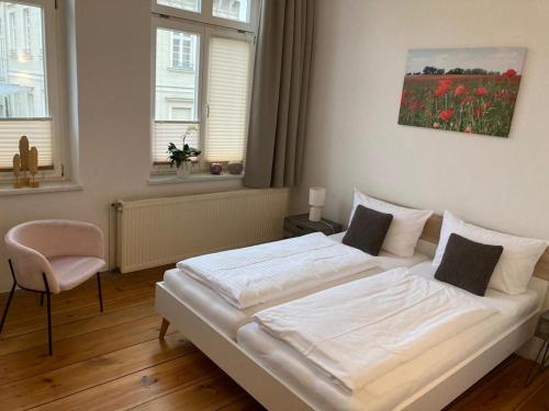 Bilderbuchcafe - Ferien - Apartment NO 3 - Markt 7客房内的一张或多张床位