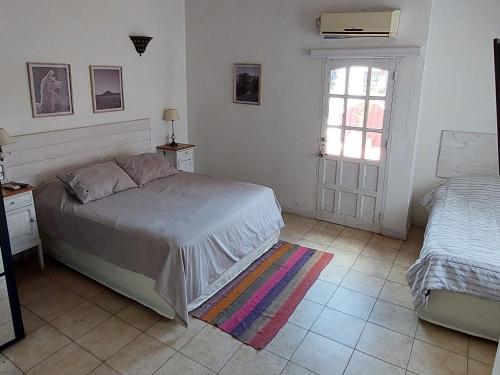 Casa Bordó Salta客房内的一张或多张床位