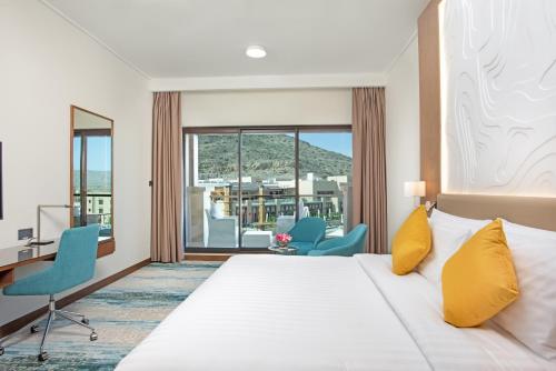 dusitD2 Naseem Resort, Jabal Akhdar, Oman客房内的一张或多张床位