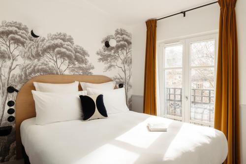 My Maison In Paris Montmartre客房内的一张或多张床位