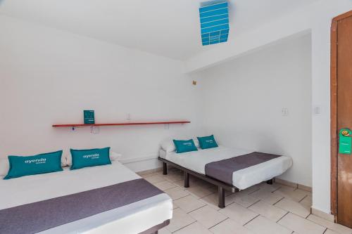 Ayenda Oasis Airport客房内的一张或多张床位