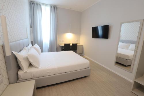 Cadorna Luxury Hotel客房内的一张或多张床位