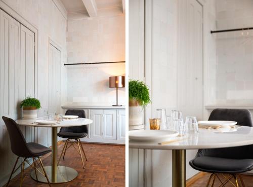 吕伐登De Olde Signorie的白色的用餐室配有桌椅