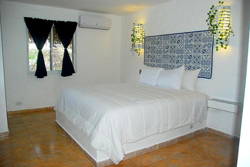 Nuovo Hotel Playa Catalina客房内的一张或多张床位