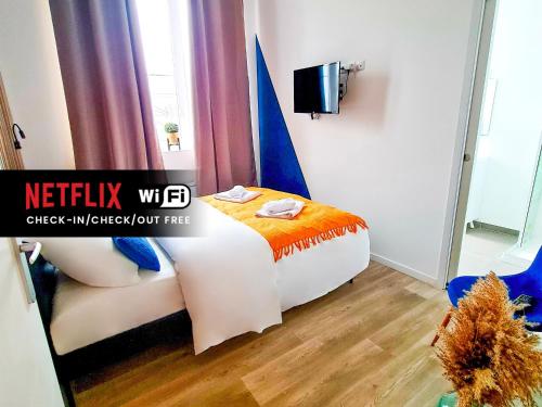 NG SuiteHome - Lille I Tourcoing Winoc - Appartement T2 - Netflix - Wifi - Cuisine - Parking gratuit客房内的一张或多张床位