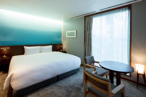 HOTEL AO KAMAKURA客房内的一张或多张床位