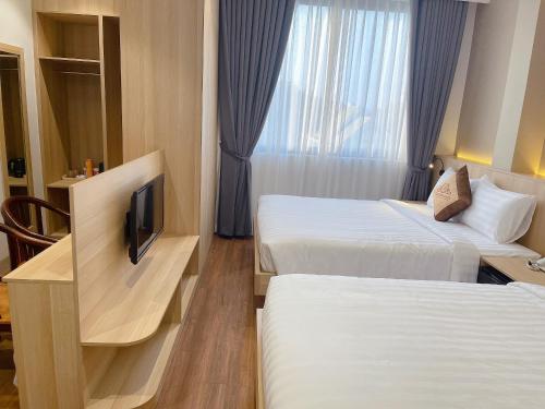 Thanh Bình Hotel - 47 Y Bih - BMT客房内的一张或多张床位