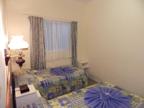 诺福克岛全景海滨公寓客房内的一张或多张床位