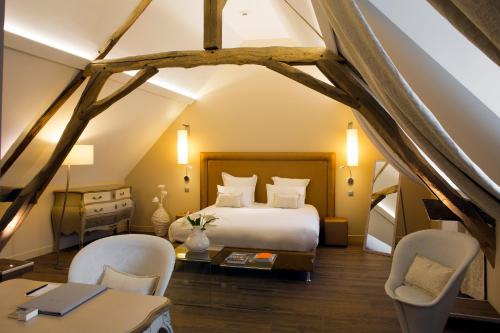Maison Doucet - Relais & Châteaux客房内的一张或多张床位