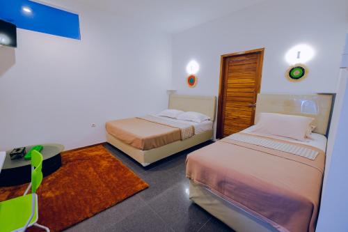 Calda Homestay Syariah客房内的一张或多张床位