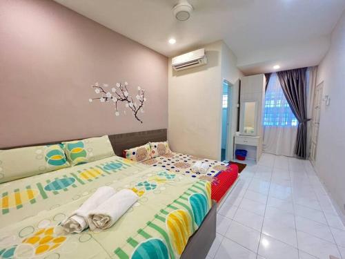 Jiaxin Homestay - Puteri Wangsa 家馨民宿客房内的一张或多张床位