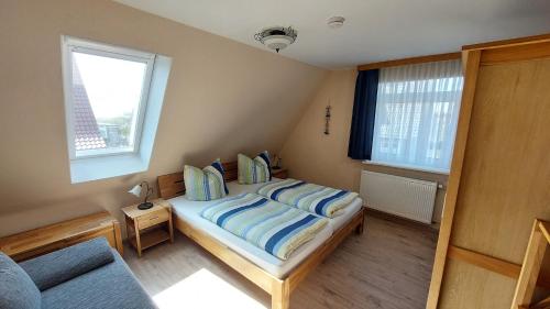 Ferienhaus Nordstrand Whg 4客房内的一张或多张床位