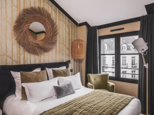 Maisons du Monde Hotel & Suites - Nantes客房内的一张或多张床位