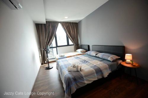 3BR Jazz Suites Vivacity Megamall Kuching Sarawak客房内的一张或多张床位