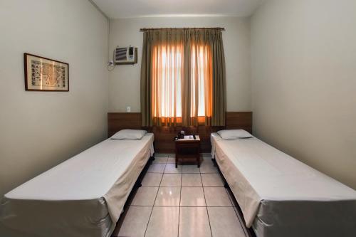 伊塔马拉蒂酒店客房内的一张或多张床位