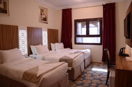 Artal International Hotel客房内的一张或多张床位