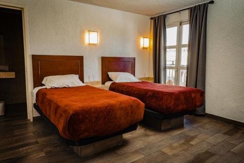 阿苏塞纳酒店客房内的一张或多张床位