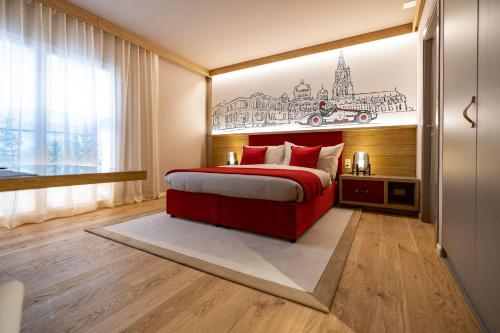 伯尔尼NEW OPENING 2022 - Los Lorentes Apartments Bern City的卧室配有红色的床,墙上挂着画