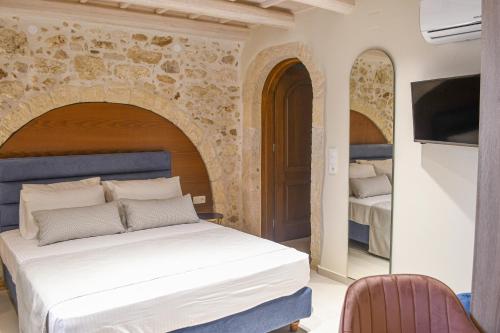 Philikon Luxury Suites客房内的一张或多张床位