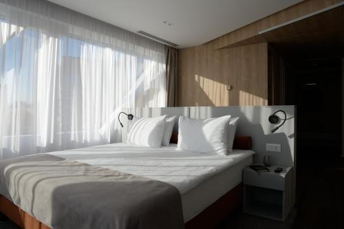Premier Hotel Miskolc客房内的一张或多张床位