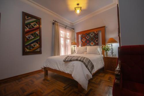 阿雷基帕阿雷基帕旅馆的一间卧室设有一张床和一个窗口