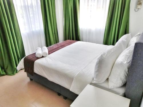 FAMISA Eastern Gold Service Apartment客房内的一张或多张床位