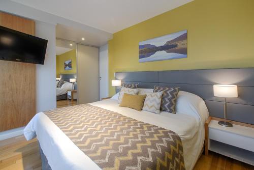 AMANCAY DEL LAGO - Apartamento a Orillas del Lago客房内的一张或多张床位