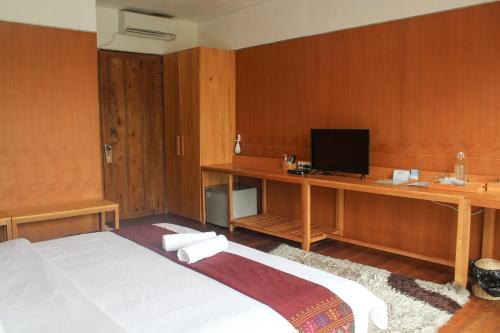 Natuna Dive Resort客房内的一张或多张床位