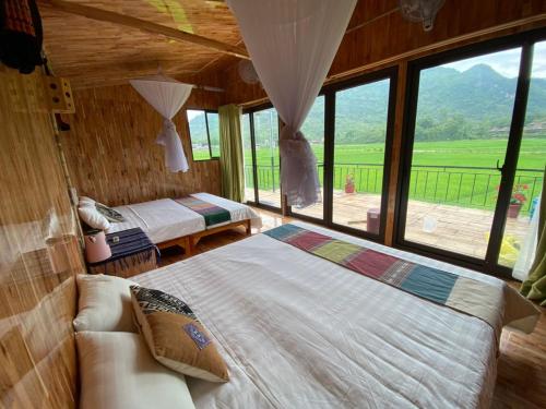 Little Mai Chau Home Stay客房内的一张或多张床位