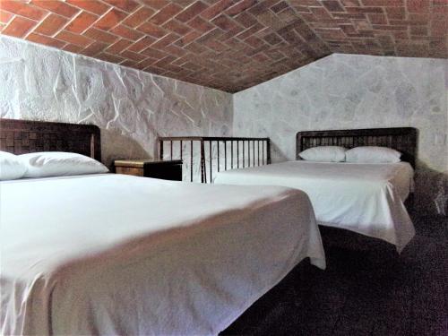 Hotel Casa de Lirio Diamante客房内的一张或多张床位