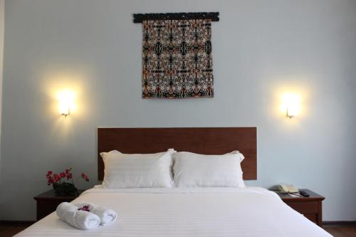 马鲁里酒店客房内的一张或多张床位
