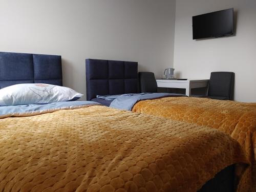 Pokoje U lalusia客房内的一张或多张床位