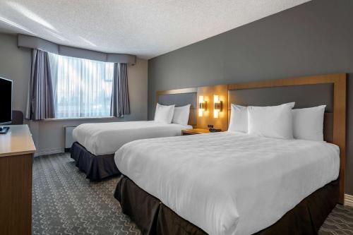 Best Western Plus Vancouver Airport Hotel客房内的一张或多张床位