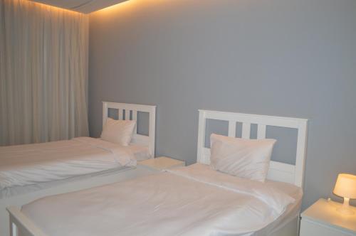 شاليهات ويف -Wave Resort客房内的一张或多张床位