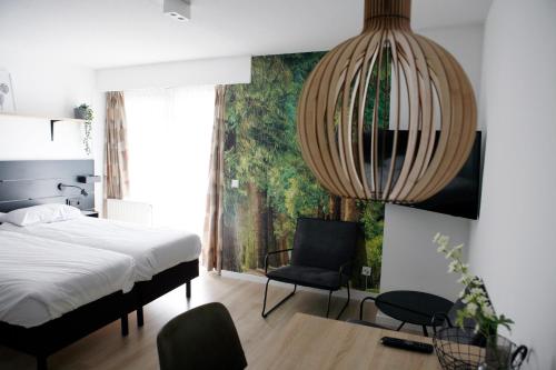 Hotel & Appartementen - De Zeven Heuvelen客房内的一张或多张床位